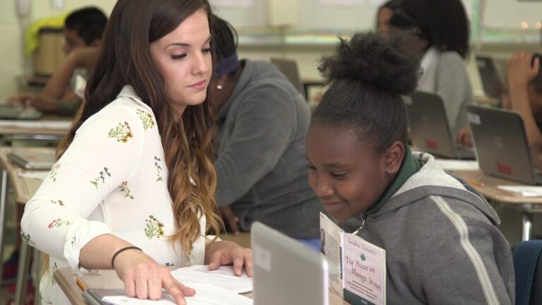 Female instructor teaching student